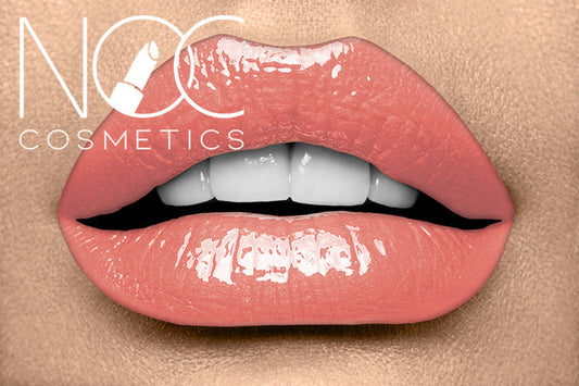 Close-up of lips wearing glossy peach lipstick from the Lip Lover Set by NOC Cosmetics