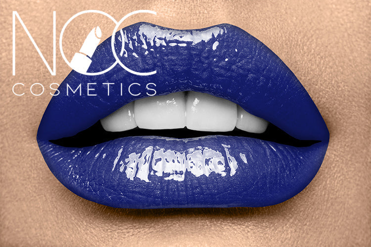 Close-up of lips wearing glossy deep blue Lipgloss - Midnight Eclipse with smooth, shiny texture