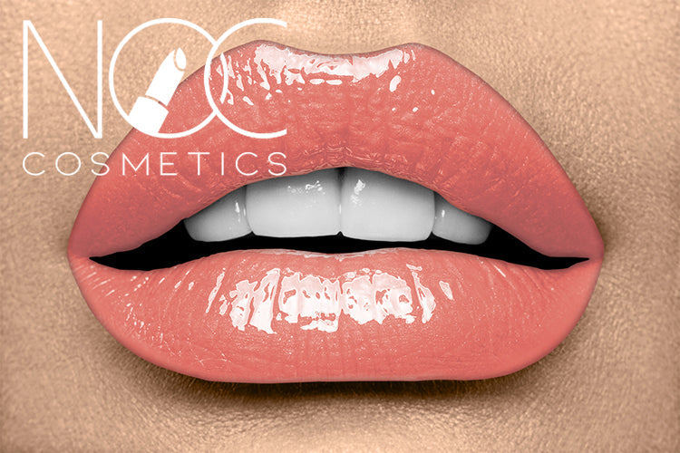 Close-up of lips wearing glossy peach lipstick from the Lip Lover Set by NOC Cosmetics
