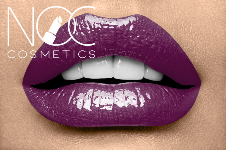 Close-up of lips wearing shiny deep purple Lipgloss - Purple Haze on smooth skin background.