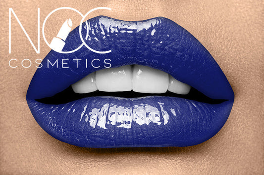 Close-up of lips wearing glossy deep blue Lipgloss - Midnight Eclipse with smooth, shiny texture