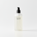 Unscented Body Oil bottle with pump dispenser, part of the Glow Starter Kit on a white background